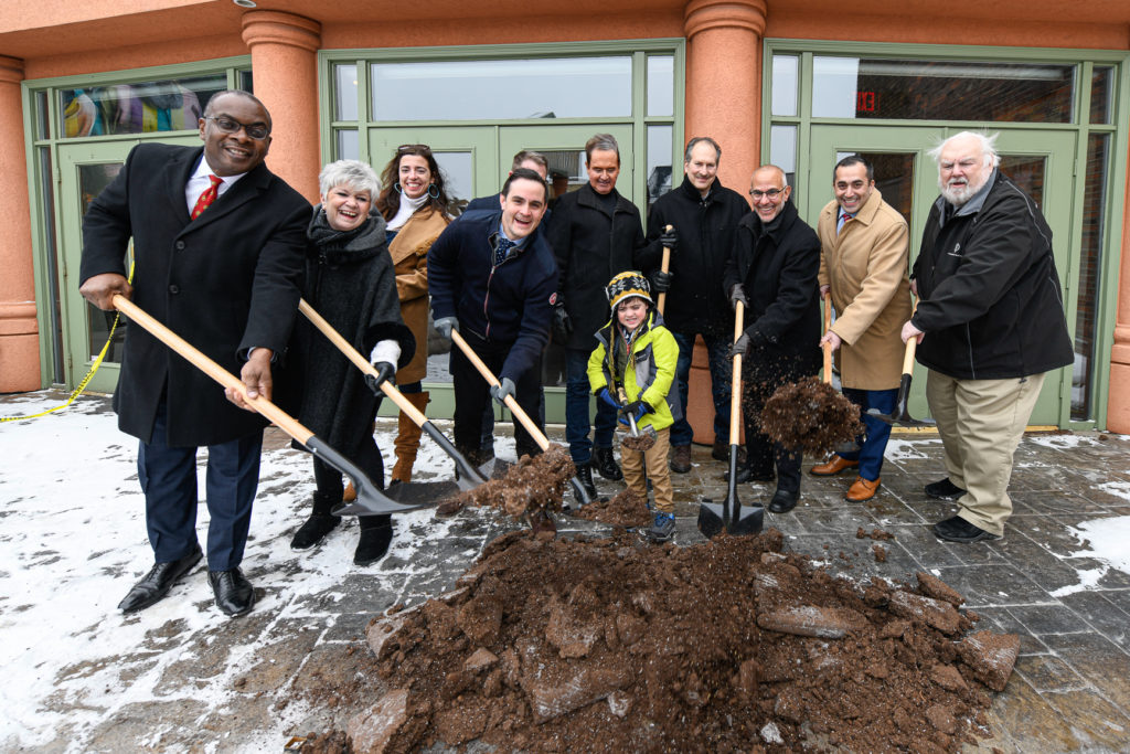 A  number of people holding shovels at the groundbreaking event