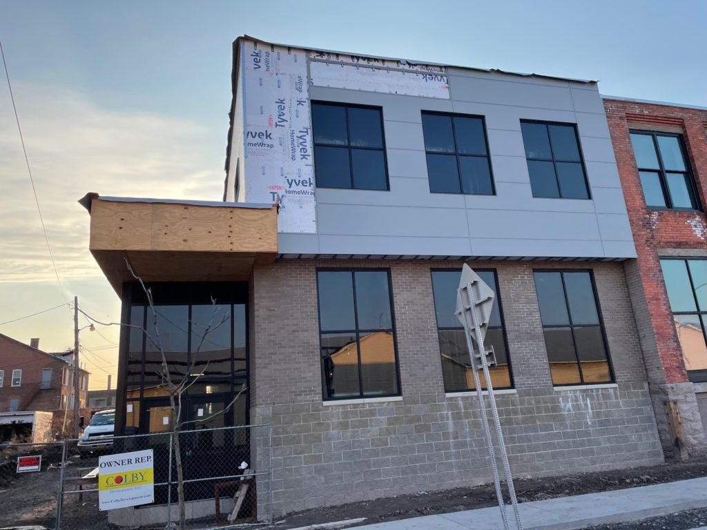 Photo of the buildings - new addition on left and historic brick on right