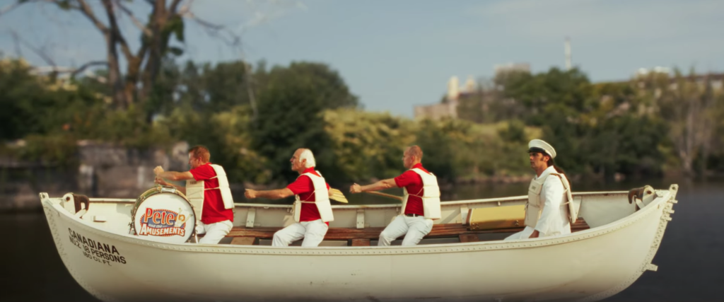 Photo: The band rowing in a Canadiana lifeboat - filmed at The Buffalo Maritime Center, with green screen