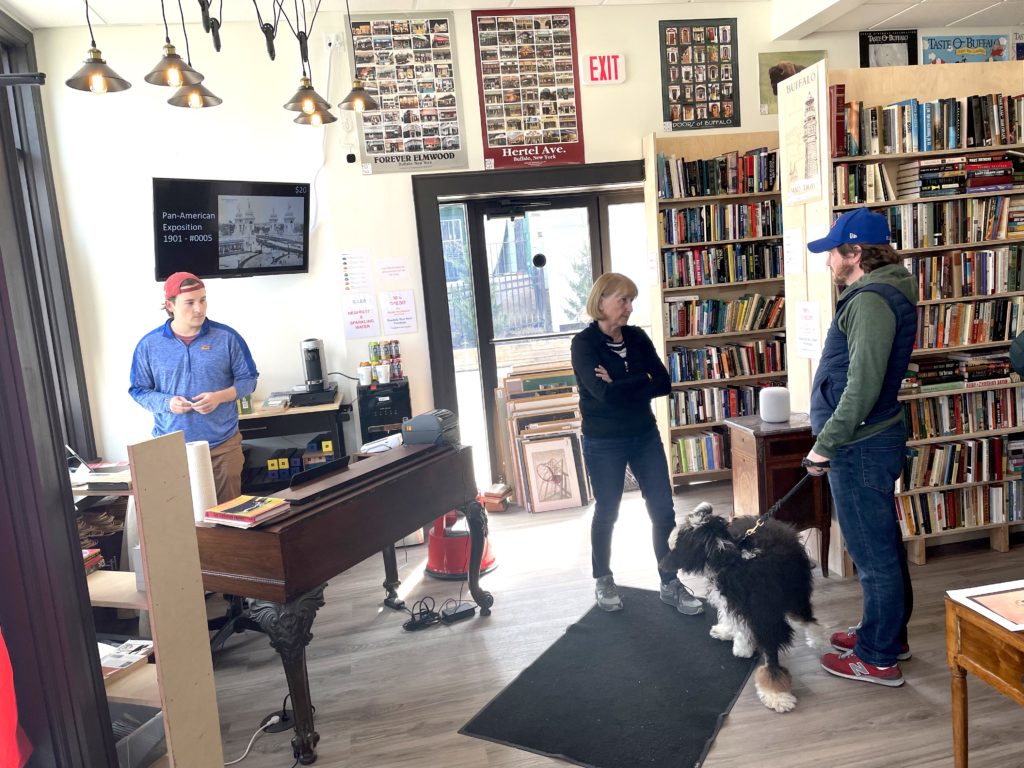 Photo of a man with a dog in the shop