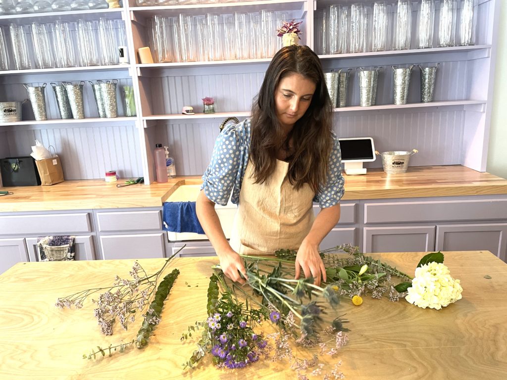 Photo of Samantha arranging a bouquet
