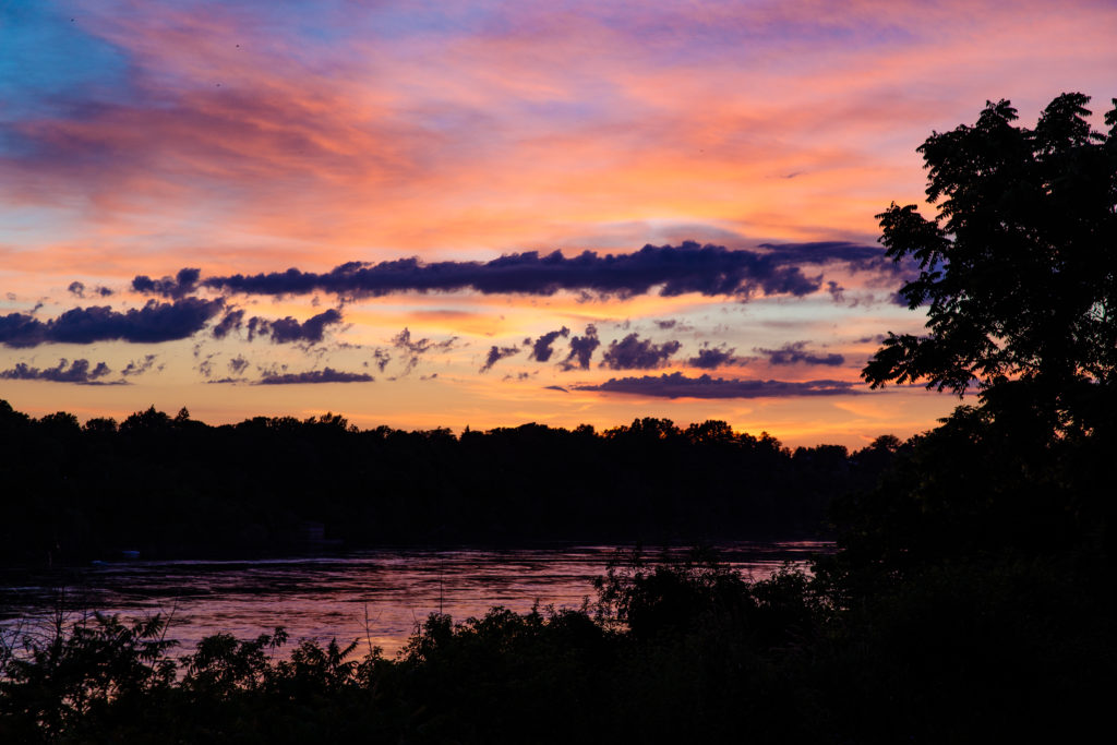 Golden hour - the sky is highlighted in pink, purple, and orange as the sun finishes setting