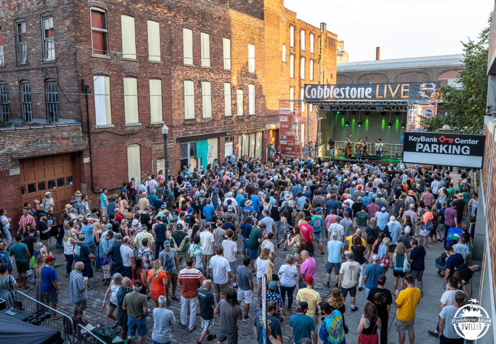 Fans enjoy one of the many live bands at Cobblestone Festival 2019