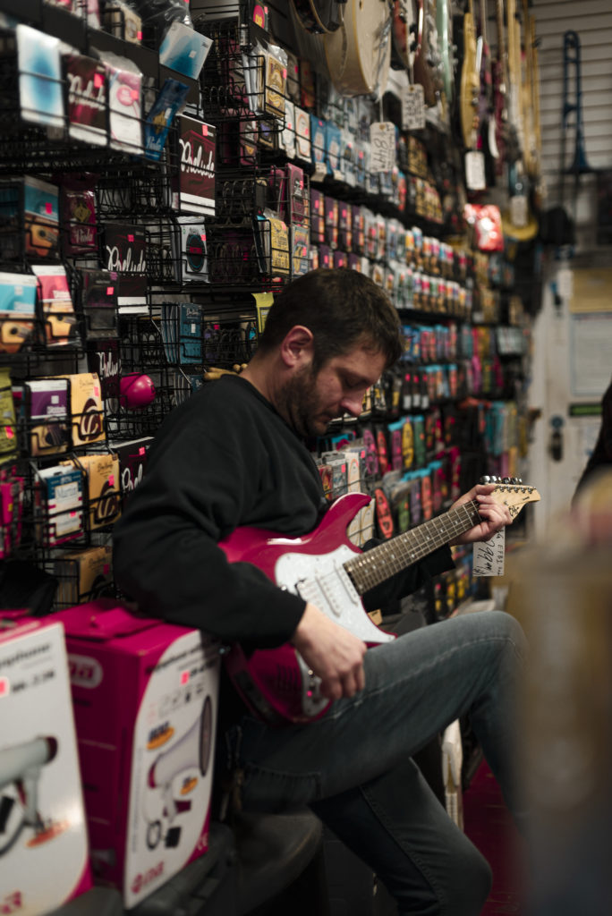 Joe Maniaci, Owner of Allentown Music gives a guitar demonstration