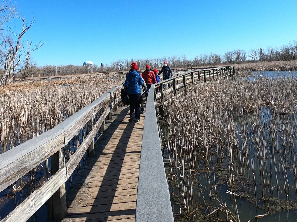 A group enjoys a walk through Tifft Nature Preserve