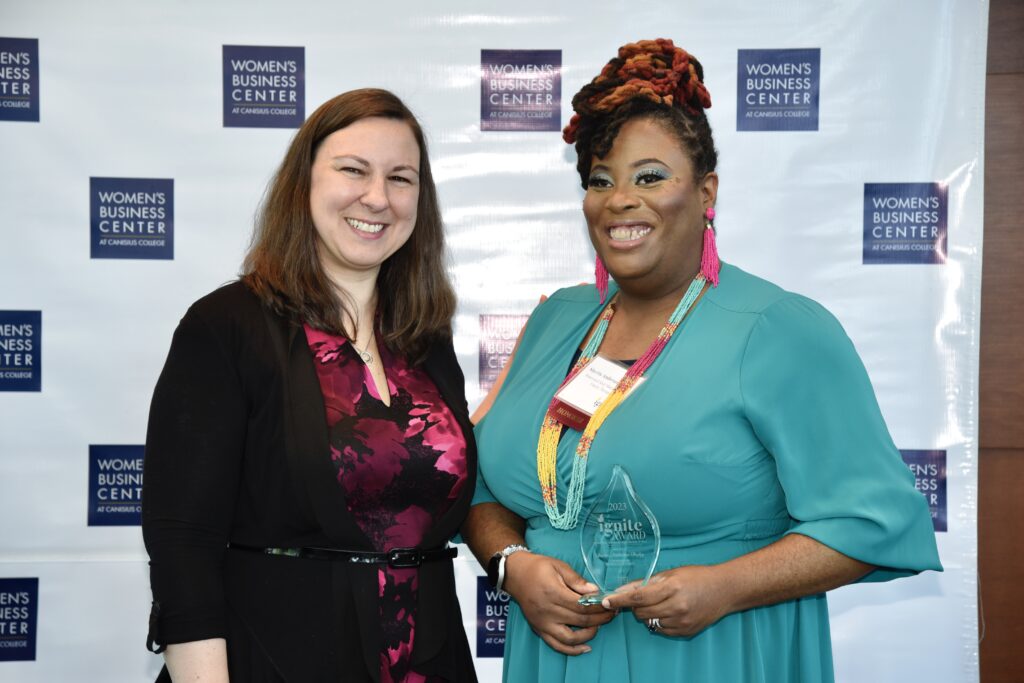 Sherita poses with her award and Sara