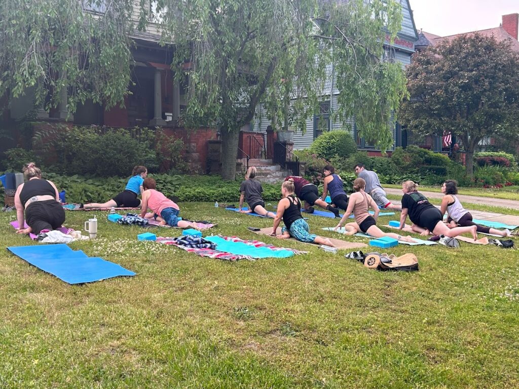 One of a Kind Yoga enjoys the warm weather, holding class outside