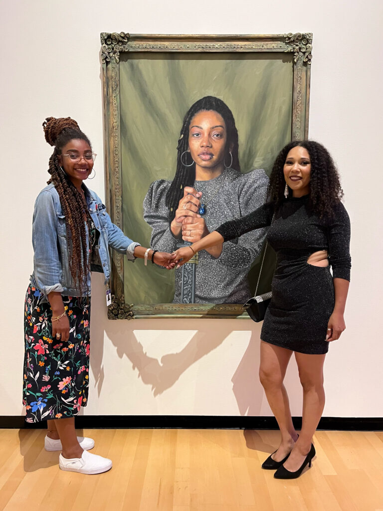 Curator Tiffany Gaines and Artist Julia Bottoms with her painting Victory Through Words, 2023.